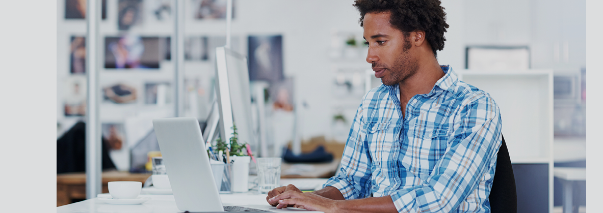 Shot of a handsome young designer working at his office desk