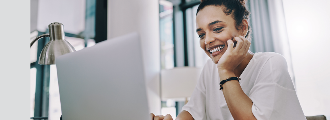 Shot of a young businesswoman using a laptop while working in her home office